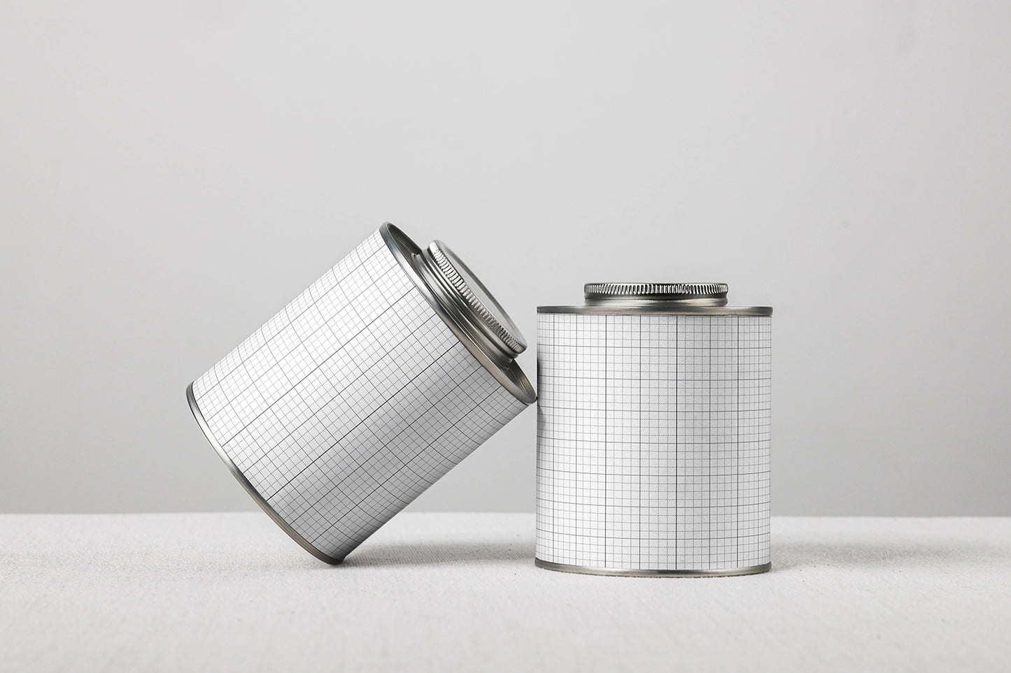 packaging tin can mockup set with two containers, simple and modern studio composition