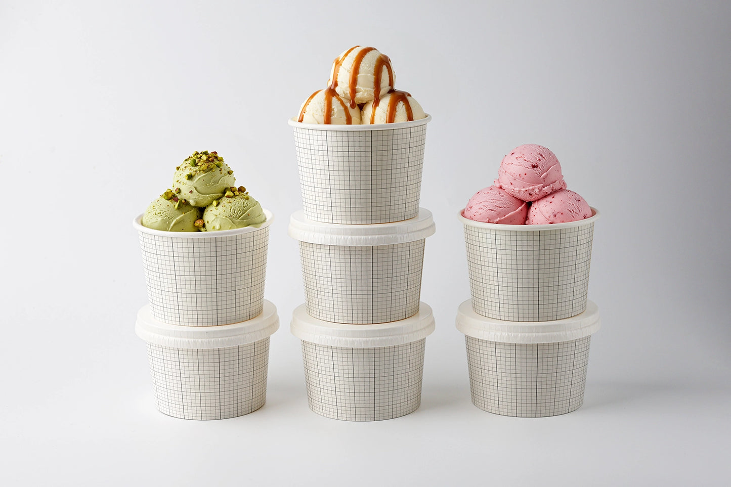 Dessert branding mockup with stacked ice cream cups and realistic topping presentation