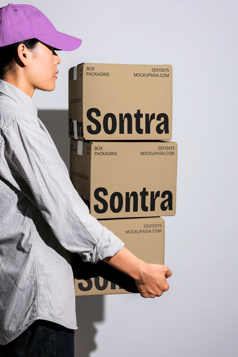 Colorful box packaging mockup with multiple boxes carried in arms minimal background
