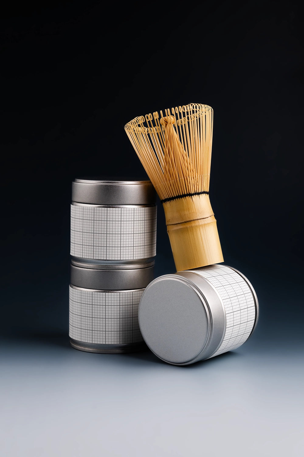 tea tin can mockup with matcha whisk and stacked layout, modern product branding setup