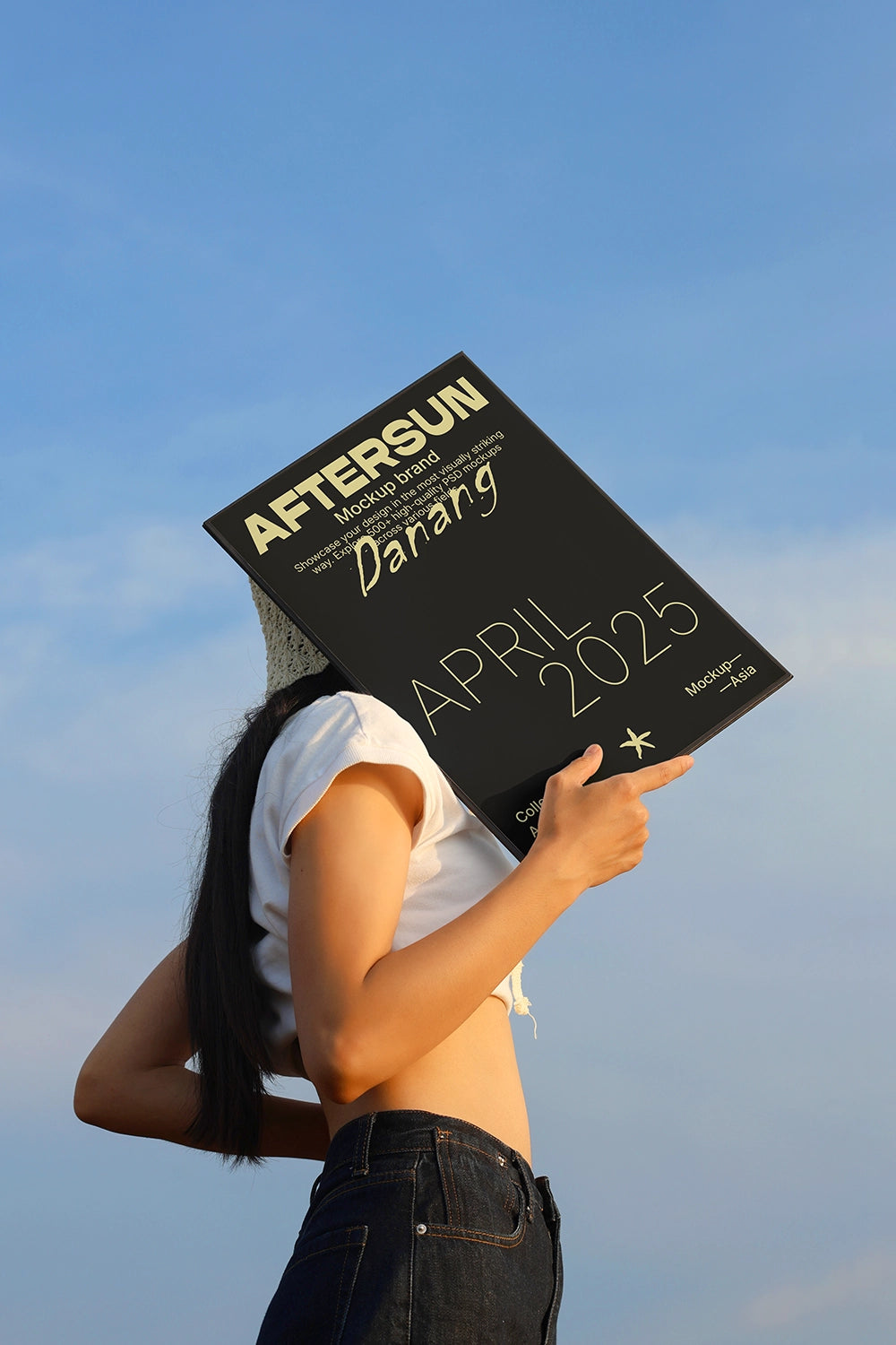 realistic poster mockup with person holding print outdoor sky background lifestyle scene