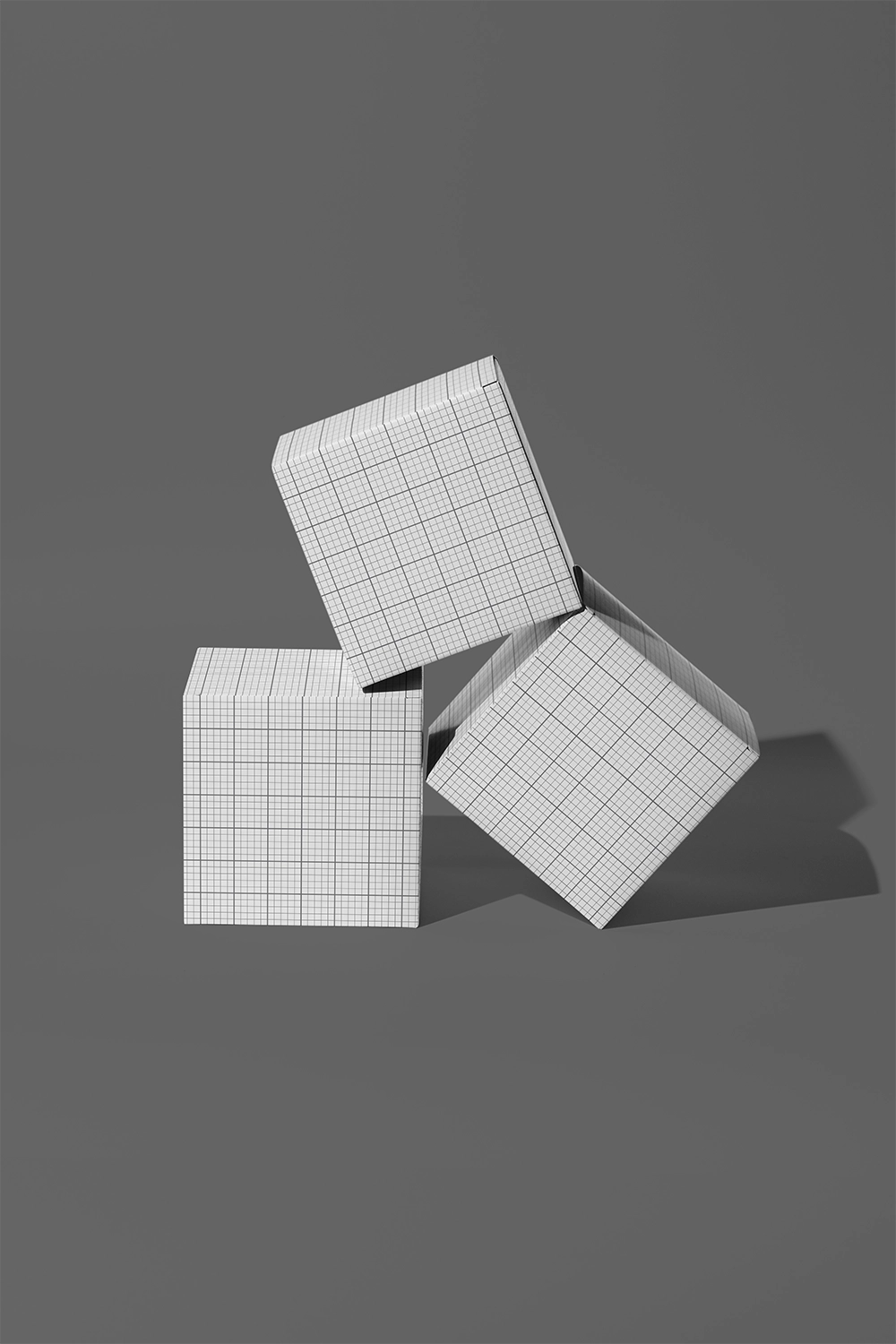 Box mockup with three cube boxes arranged in dynamic composition on black backdrop