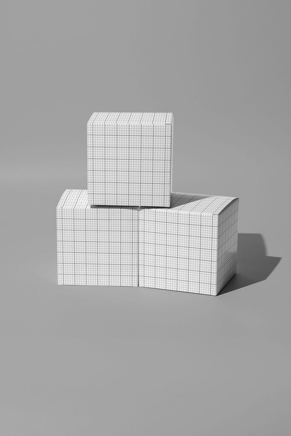 Product box mockup with geometric cube boxes in high contrast studio lighting