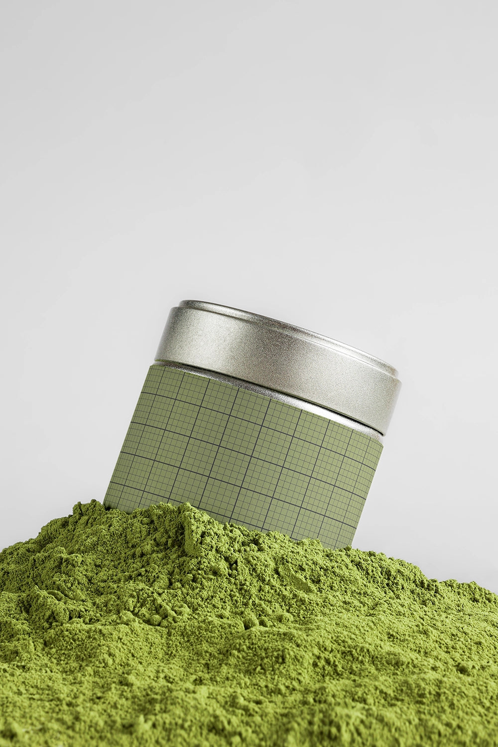 matcha tin can mockup surrounded by powder, modern product branding and natural texture