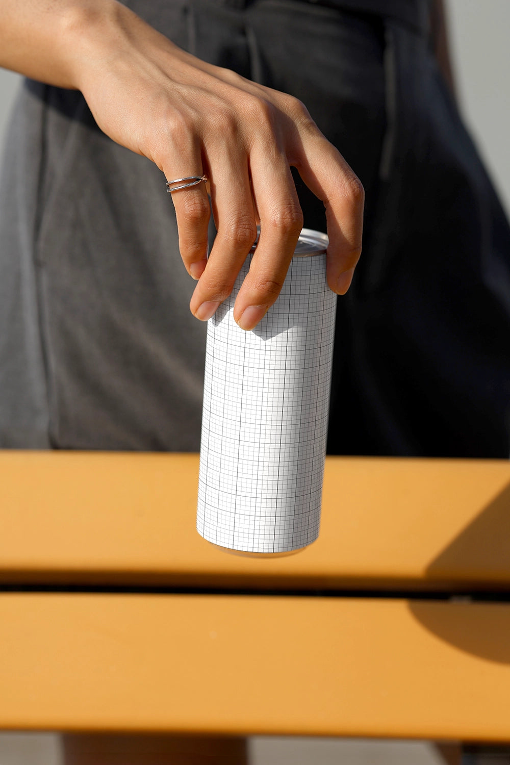 Clean soda can mockup with strong shadows and minimal lifestyle setting for packaging presentation