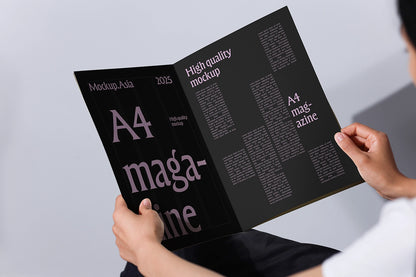 realistic magazine mockup in hand open spread minimal typography layout high resolution psd