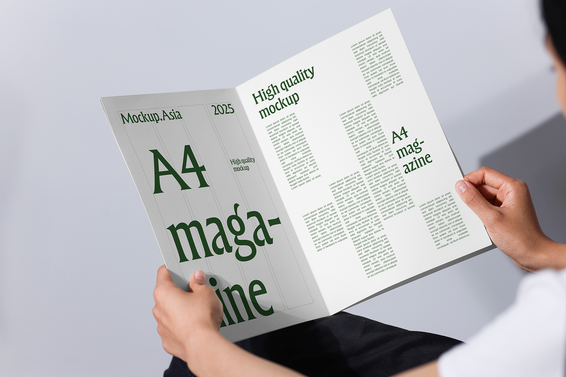 a4 magazine mockup held in hands with clean layout and soft studio lighting editorial design