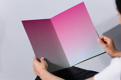 print magazine mockup open pages in hands with soft shadow and minimal background