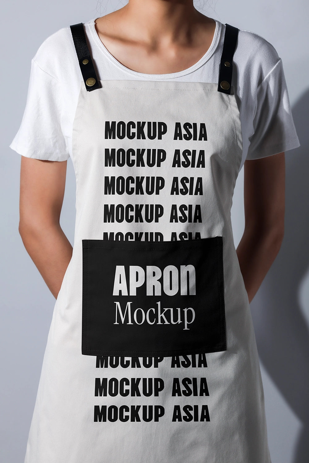 apron mockup worn by model with clean studio lighting realistic fabric texture branding presentation