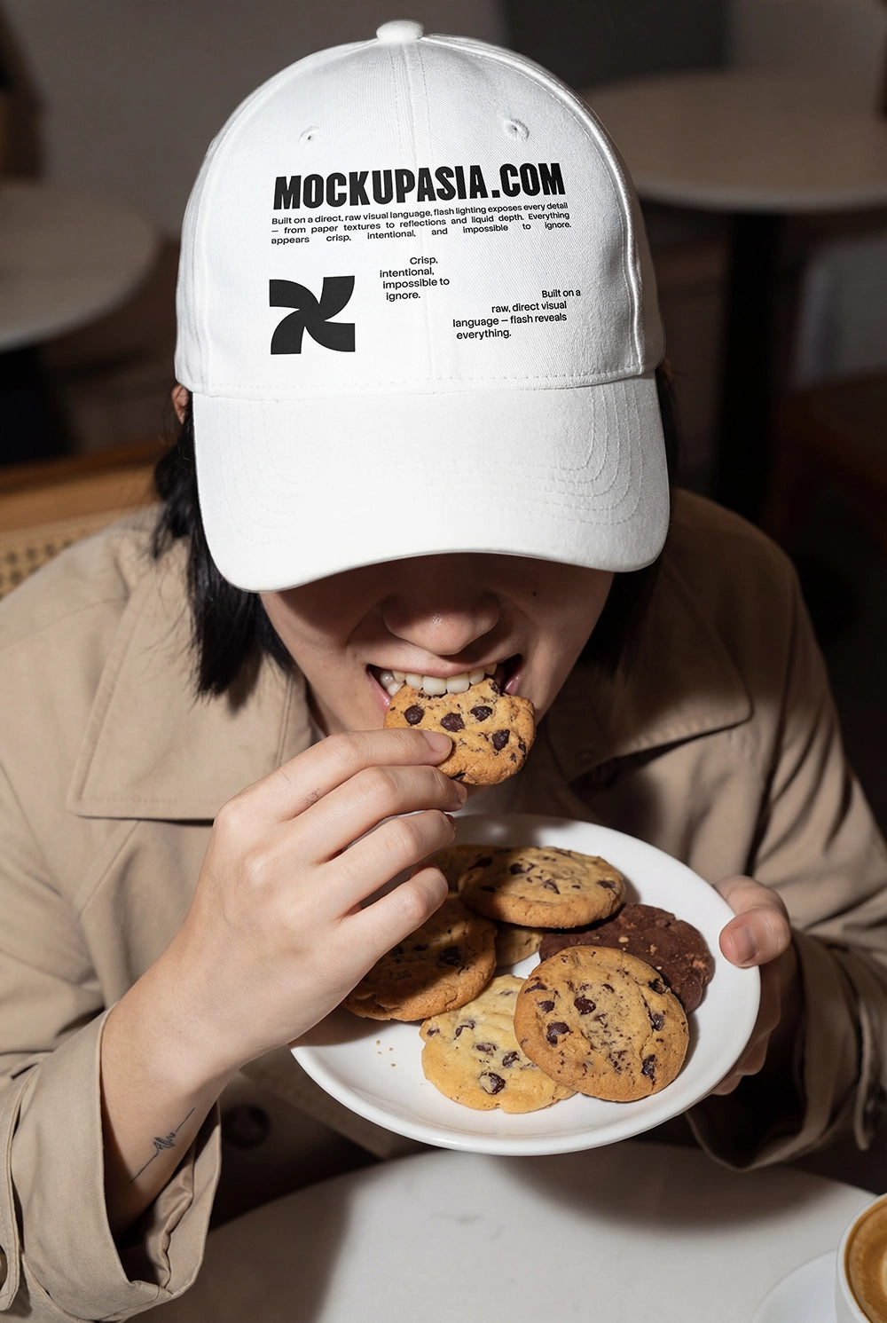 cap mockup on model eating cookies with high contrast flash lighting
