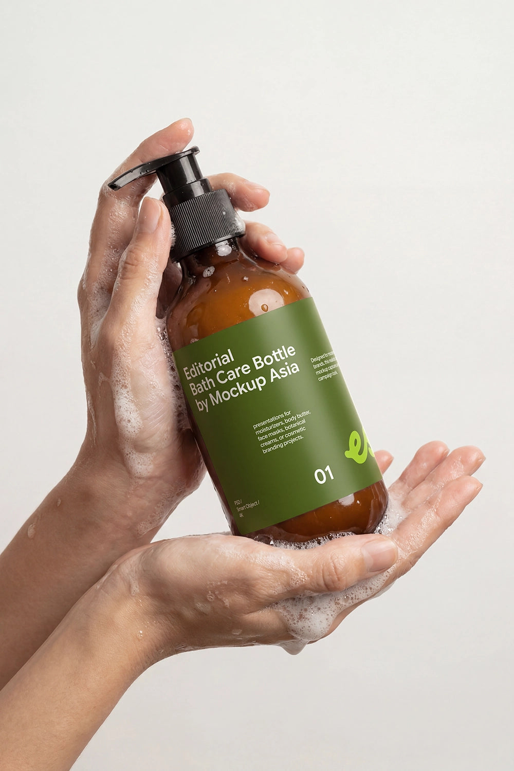 Body wash bottle mockup with hands and cleansing foam for branding presentation.