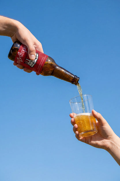 Lifestyle beer branding mockup with realistic liquid motion and sunlight