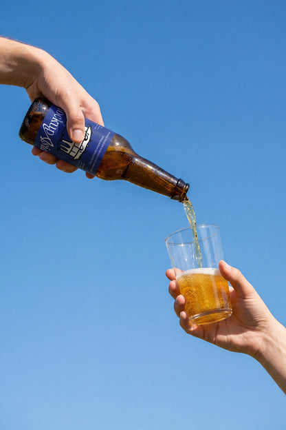 Amber glass beverage bottle PSD mockup with editable label design