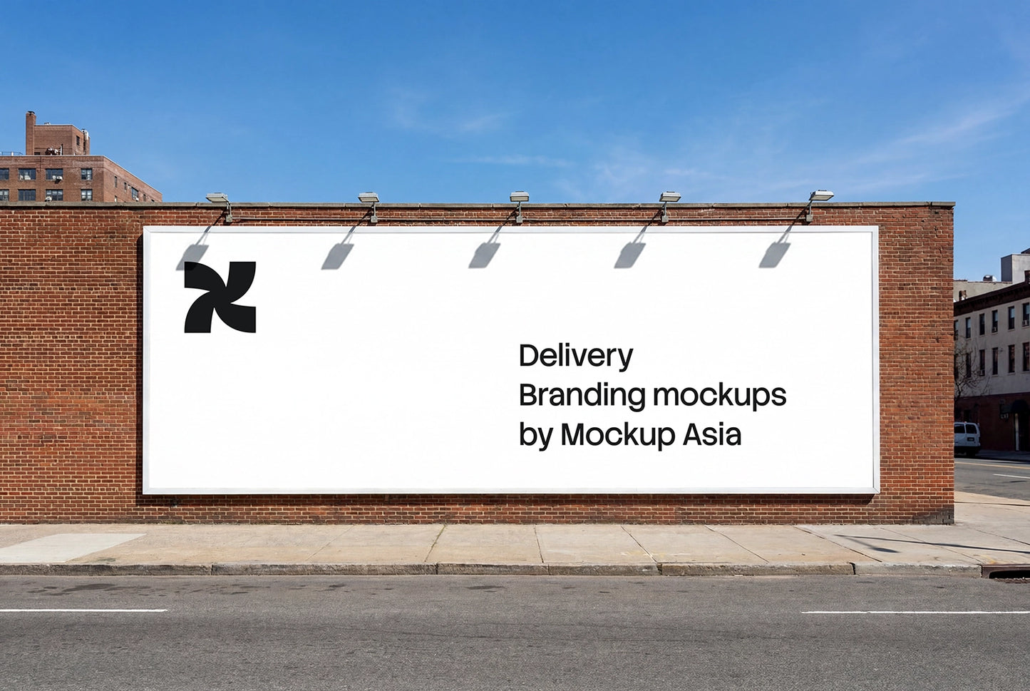 Large outdoor wall billboard mockup mounted on brick building in urban street setting