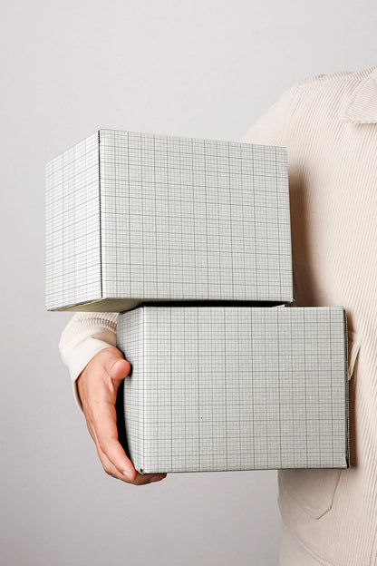 Ecommerce shipping box mockup with stacked parcels and clean branding layout