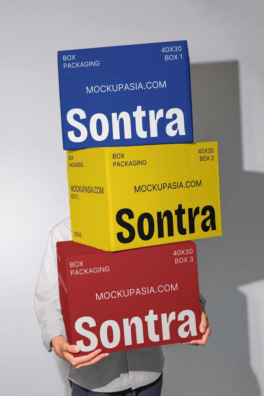 Shipping box mockup with bold typography and colorful packaging stacked vertically