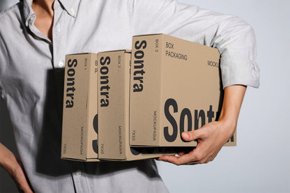 Cardboard box mockup set held in hands with multiple packaging boxes minimal background
