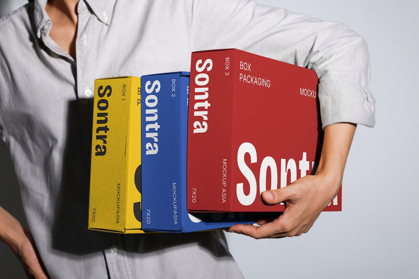 Kraft box packaging mockup with stacked boxes and realistic handheld presentation