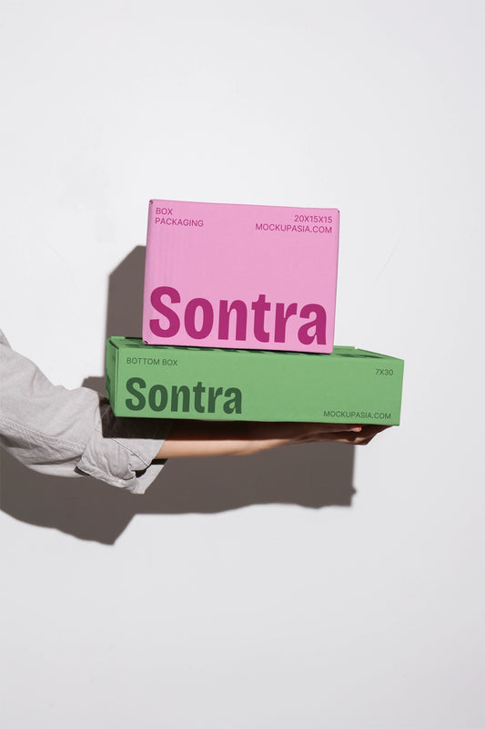 Cardboard box mockup set held in hands with multiple packaging boxes minimal background