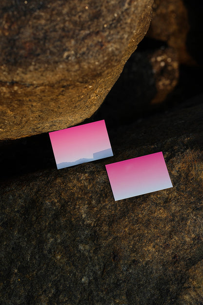 realistic poster mockup placed on stone background with golden hour lighting and natural texture