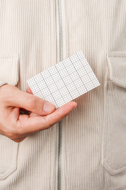 stationery business card mockup in hand with soft lighting and lifestyle presentation