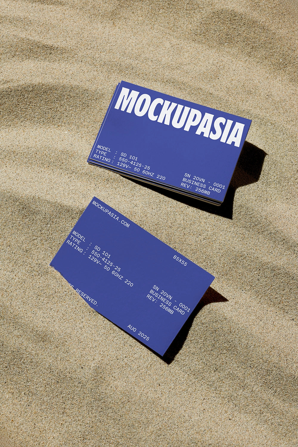 realistic business card mockup with two cards on textured sand background