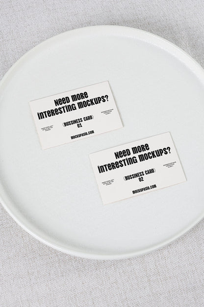 business card mockup set on plate with two cards and minimal top view composition
