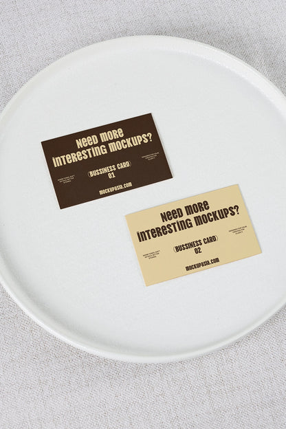 realistic business card mockup with dual cards on ceramic plate and clean background