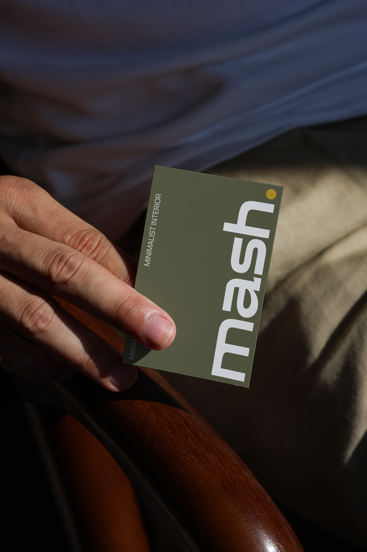 hand holding business card mockup with natural sunlight and realistic shadow on leather background