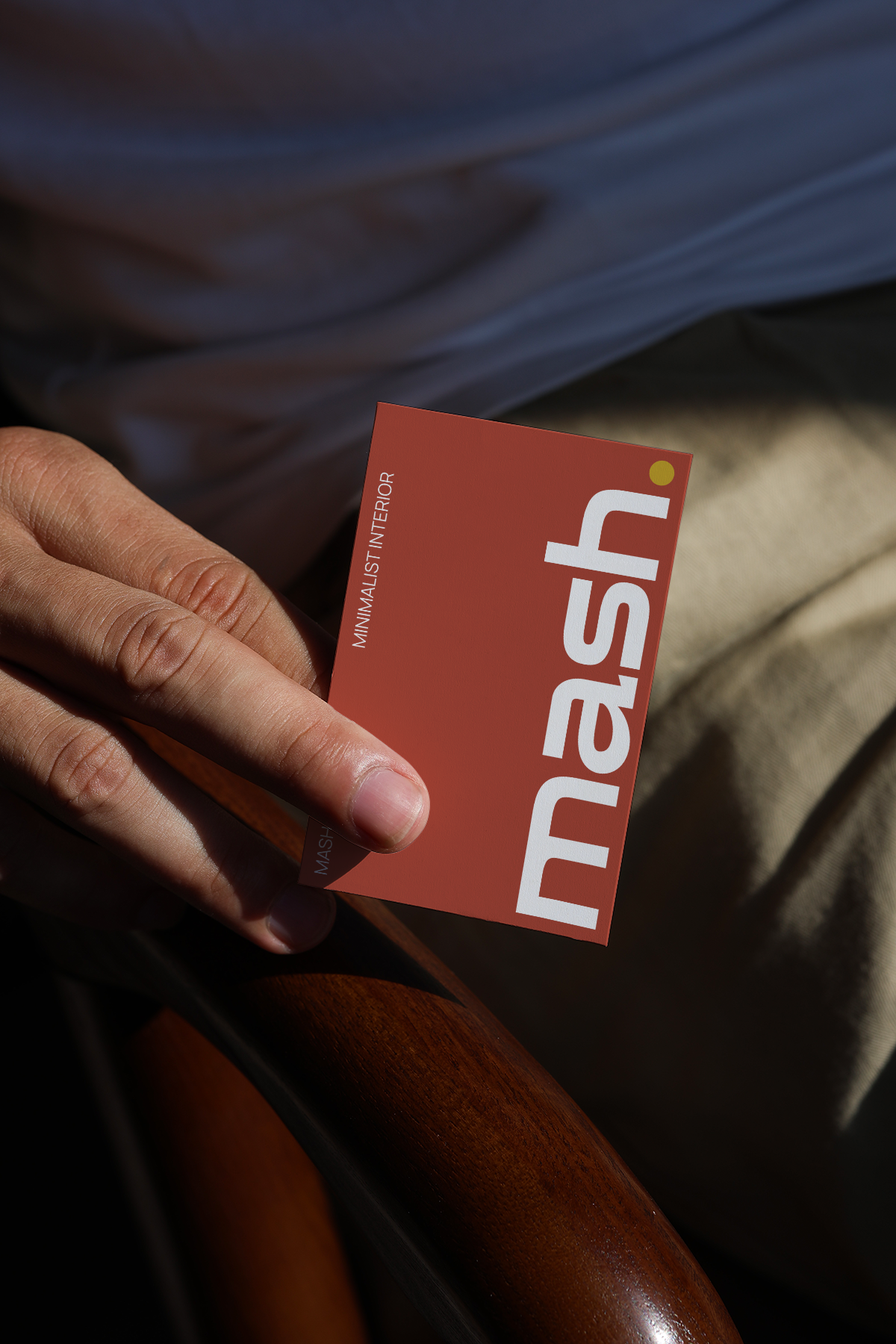 realistic business card mockup in hand with warm lighting and soft shadow branding presentation