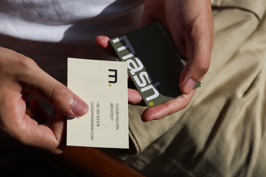 two business cards mockup held in hands with natural sunlight and realistic shadow on leather surface