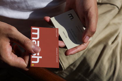 realistic dual business card mockup in hand with warm lighting and lifestyle branding presentation
