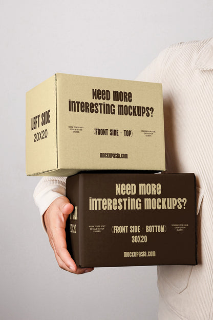 Cardboard box packaging mockup with typography design and realistic handheld presentation