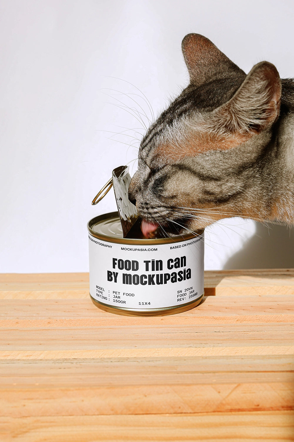 Empty cat food tin can mockup by Mockup.Asia showing a realistic metal can with a pull-tab lid, suitable for packaging design.