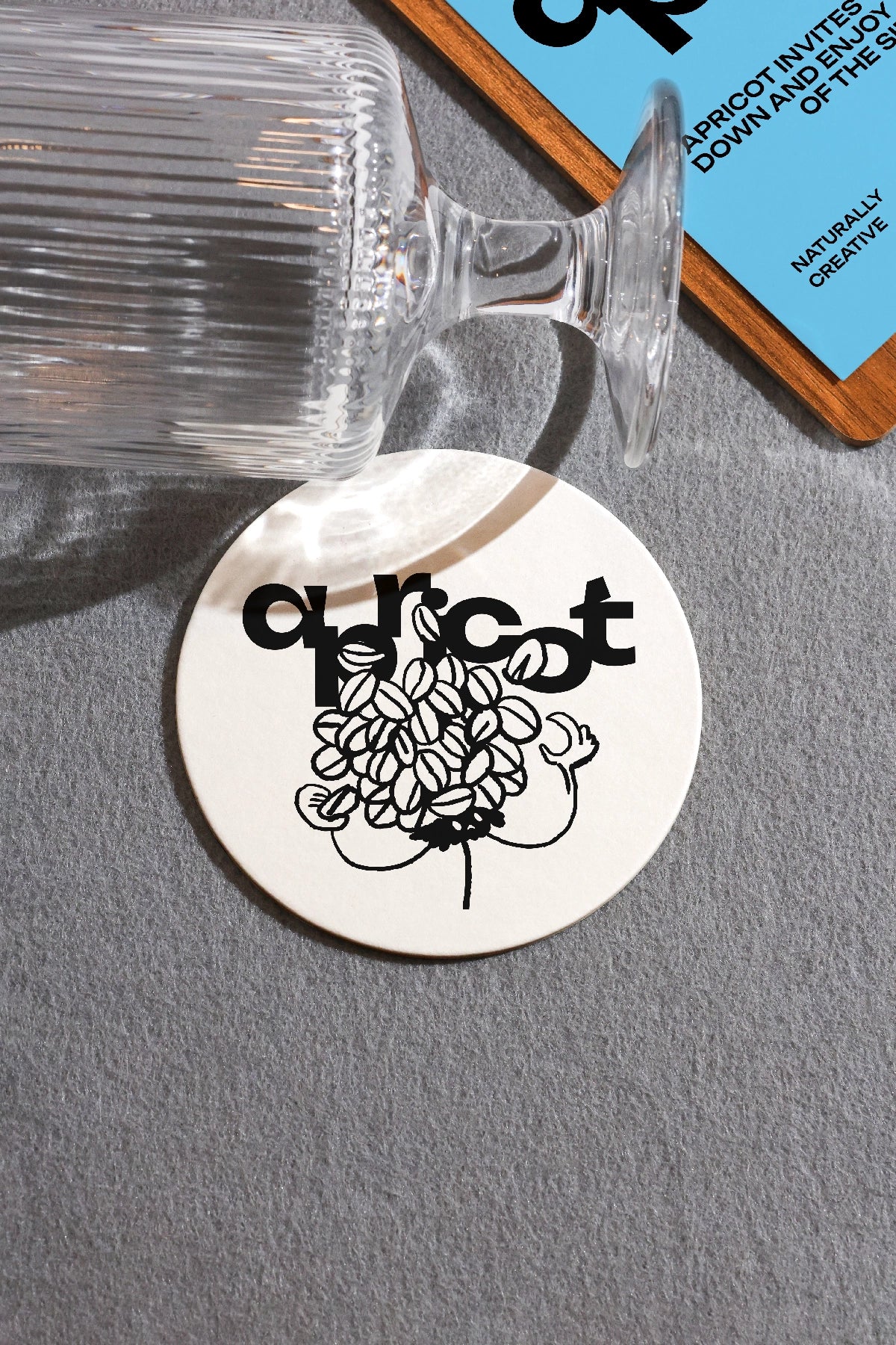 round coaster mockup with glass cafe branding psd