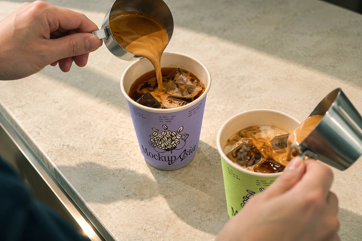 Specialty coffee takeaway cup mockup with ice and crema swirl