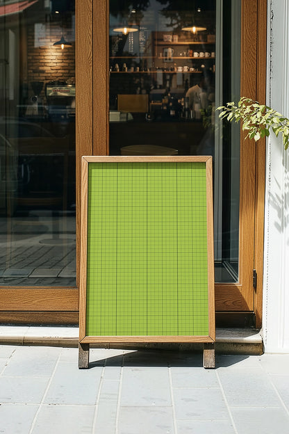 cafe A-frame poster mockup on storefront entrance with cozy interior view