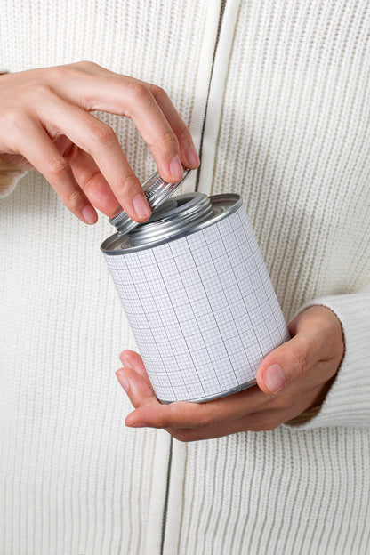 coffee tin packaging mockup held in hands with opening action, realistic product display