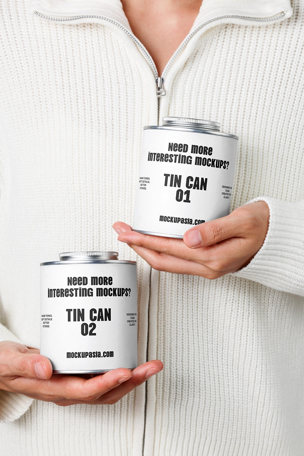 tin can mockup set held in hands with minimal knit background, lifestyle packaging presentation