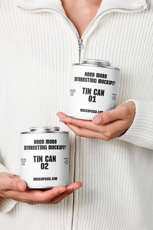 tin can mockup set held in hands with minimal knit background, lifestyle packaging presentation