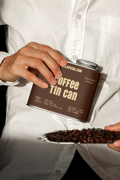 metal coffee tin can mockup with coffee beans on plate, modern branding setup