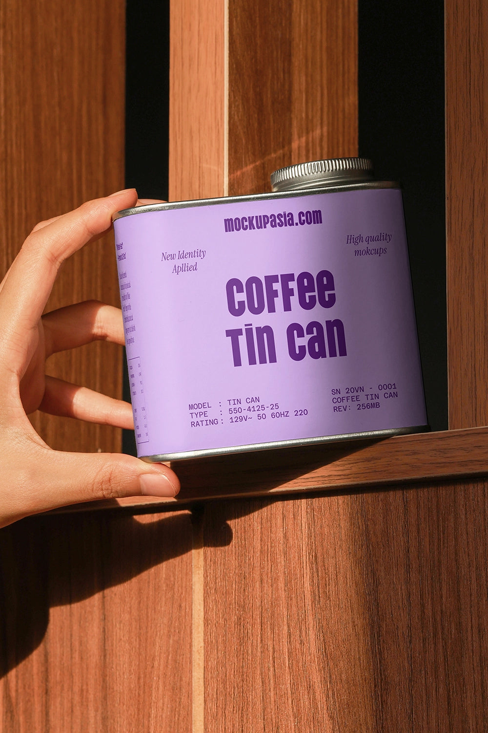 metal coffee tin can mockup on wooden shelf with hand interaction, realistic branding setup