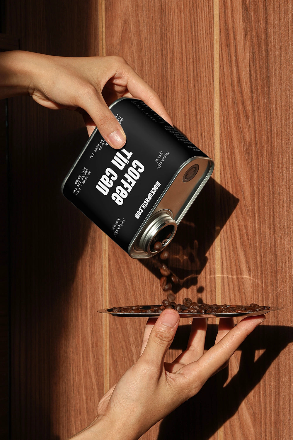 coffee packaging tin mockup with beans pouring action, realistic lifestyle product scene