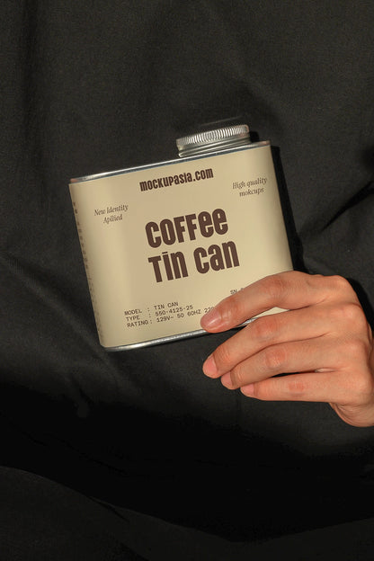 metal coffee tin can mockup in hand with soft shadow lighting, clean product display