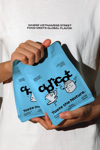 Two white coffee packaging pouches held in hand, lifestyle coffee bag mockup in natural light