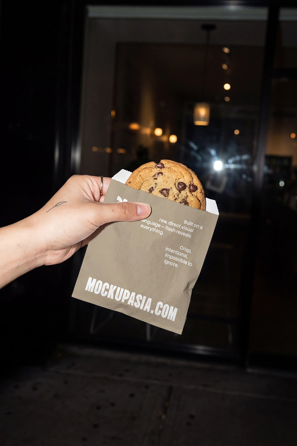 snack bag mockup with cookie takeaway under direct flash in urban setting