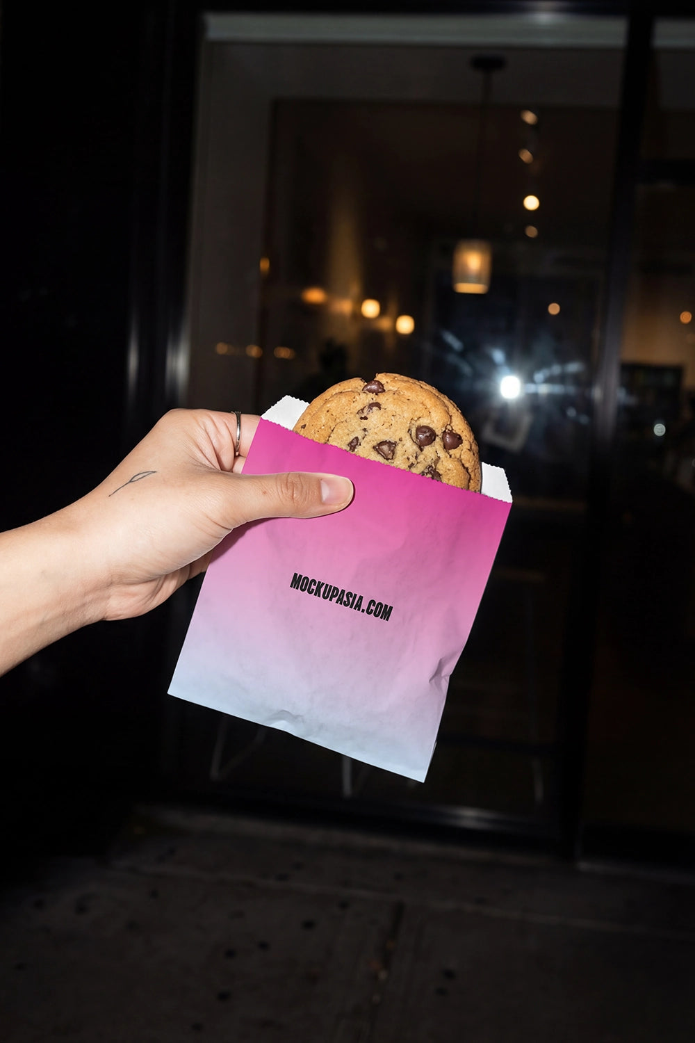 bakery packaging mockup with cookie and bold night lighting for branding