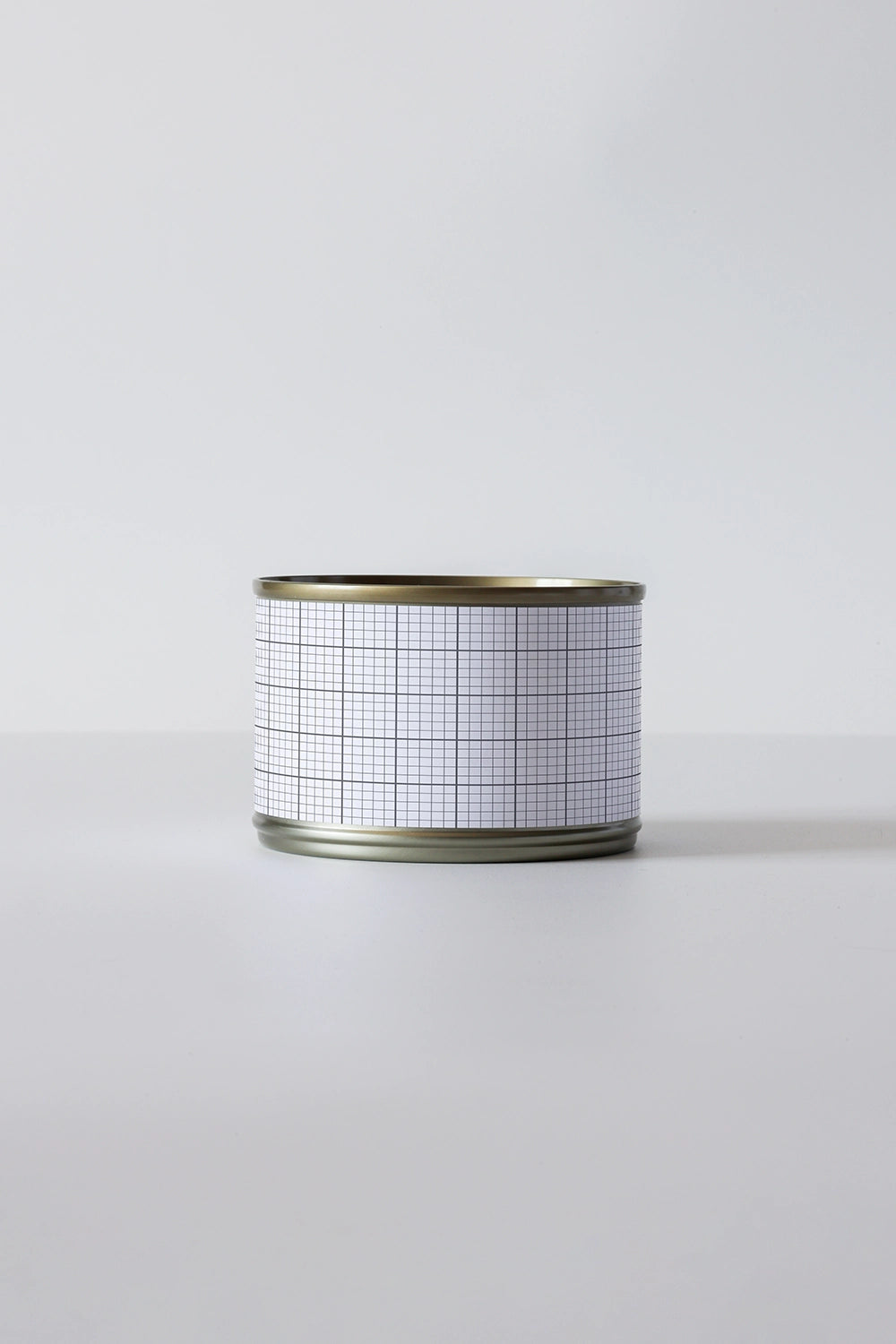 realistic metal food can mockup with blank label and soft studio lighting