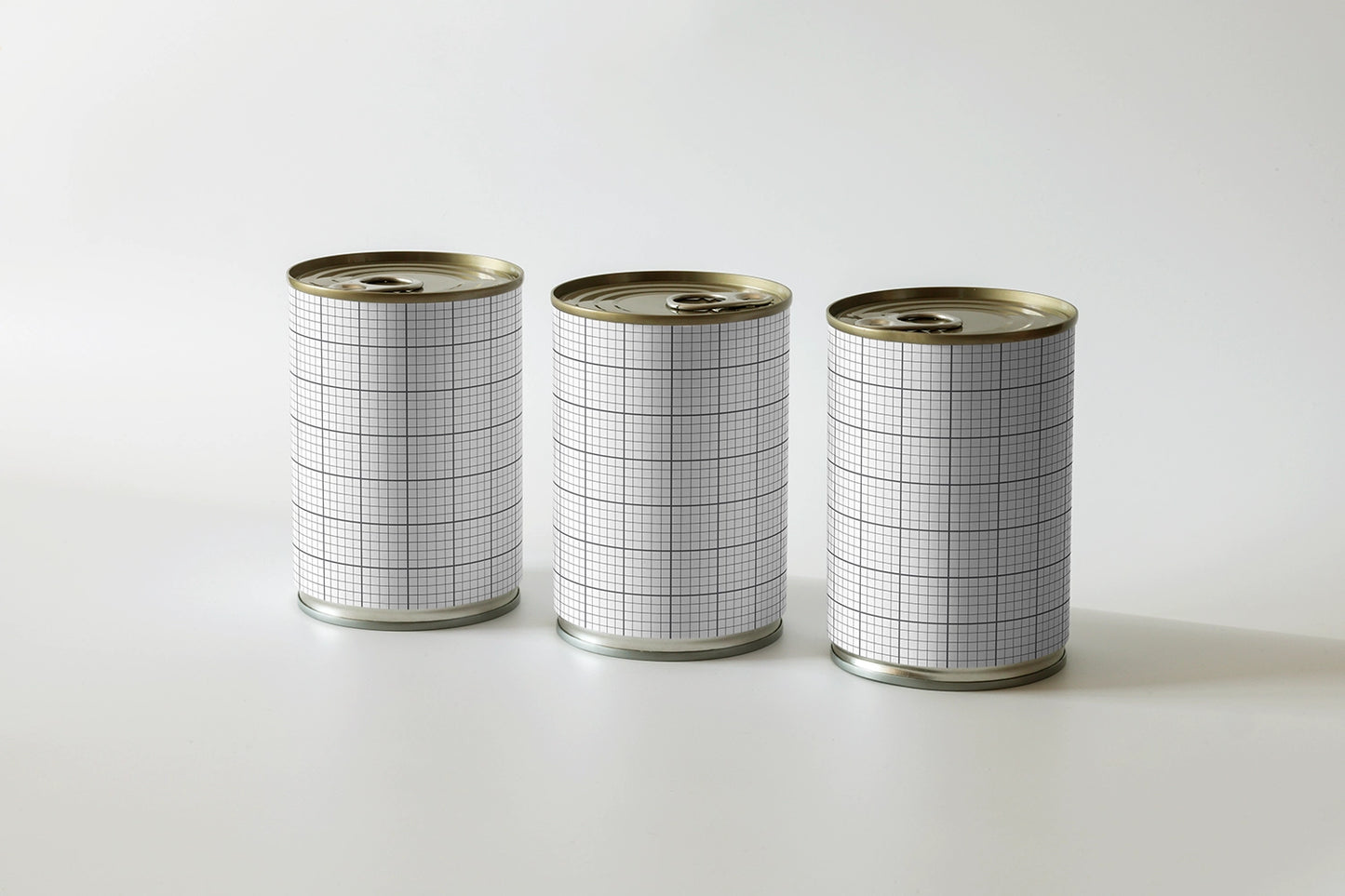 metal food can mockup trio with clean layout and soft studio lighting