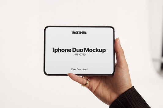 Free iPhone Duo mockup PSD held in hand